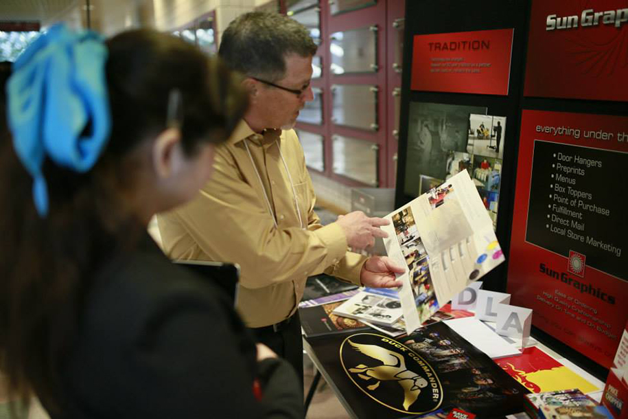 Here I am speaking with one of our exhibitors, Sun Graphics.