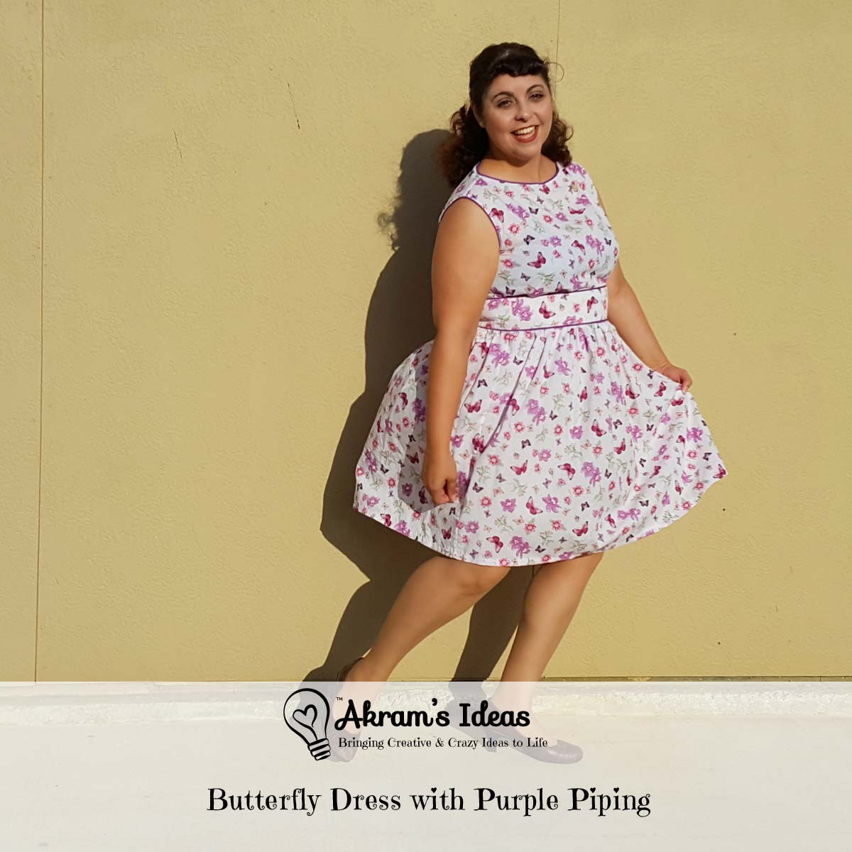 Butterfly dress with purple piping made from vintage 1960s reproduction Simplicity 1364 blouse and gathered skirt in a cotton butterfly print.
