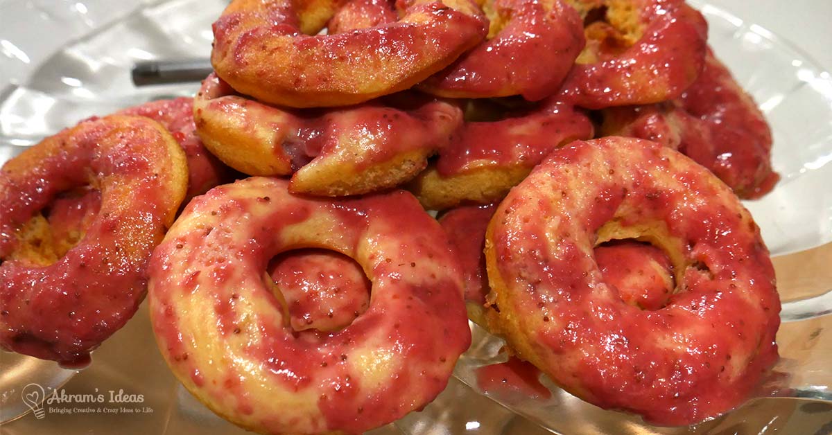 Quick Bake recipe for sugar-free fresh strawberry baked doughnuts made using a standard yellow cake mix and topped with a rich fresh straw glaze.